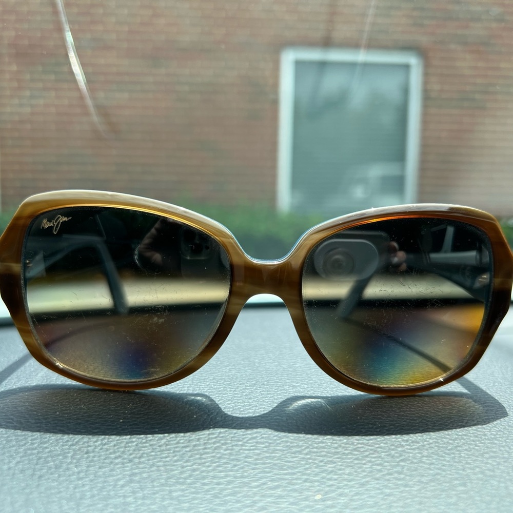 Maui Jim Kalena sun glasses . GUC. Mild scratches . Does not affect vision